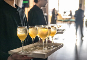 Servers-awatiing-with-a-custom-signature-cocktail-for-guests-to-arrive-for-Big-Brothers-Big-Sisters-Gala-at-The-Lighthouse-The-Pier-Sixty-Collection
