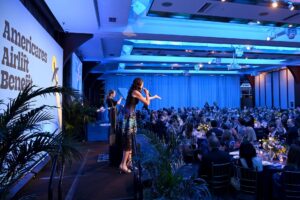 Lydia Fernet leads the auction onstage during the 2025 Americares Airlift Benefit at Pier Sixty at Chelsea Piers on April 04, 2025 in New York City. (Photo by Bryan Bedder/Getty Images for Americares)